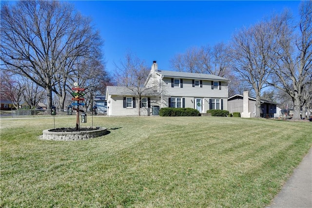 view of front of property with a front lawn and a chimney