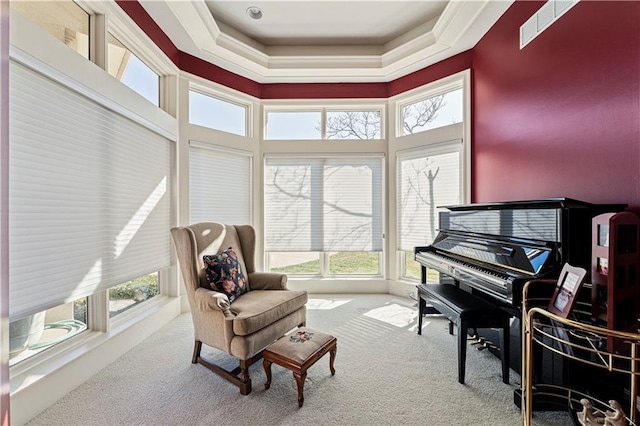 sitting room featuring carpet flooring and visible vents
