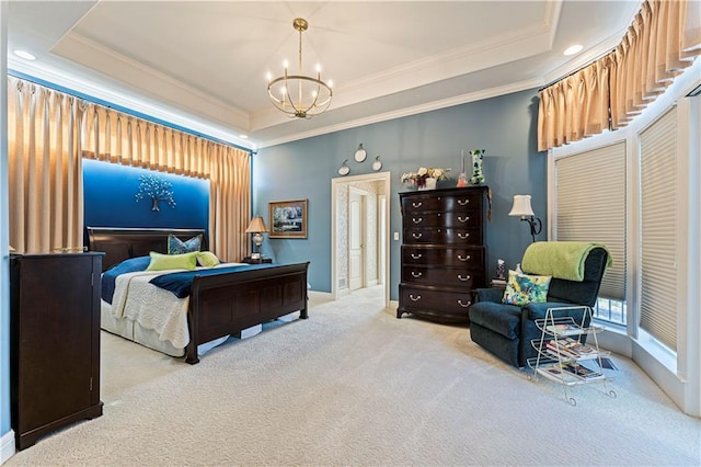 carpeted bedroom featuring baseboards, a raised ceiling, an inviting chandelier, and ornamental molding