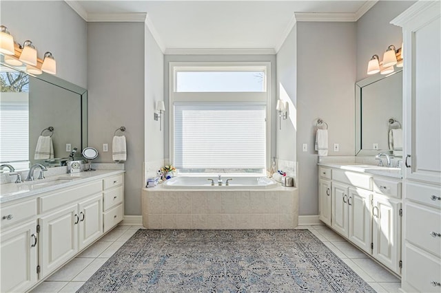 full bath featuring tile patterned floors, two vanities, crown molding, and a sink