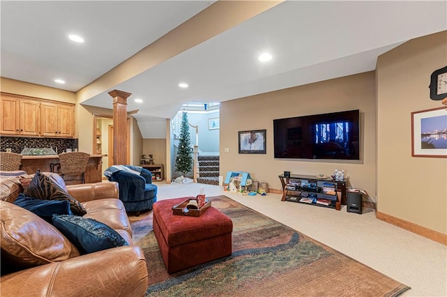carpeted living room with recessed lighting, decorative columns, baseboards, and stairway