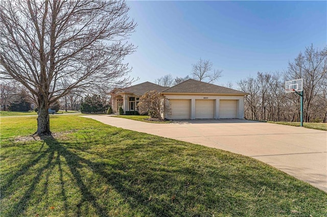 view of front of house with a garage, driveway, a front lawn, and stucco siding