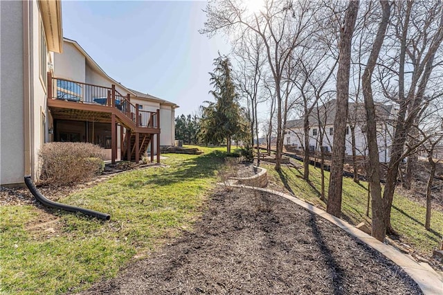 view of yard featuring stairway and a deck