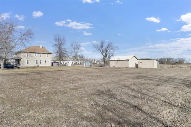 view of yard featuring an outbuilding and an outdoor structure