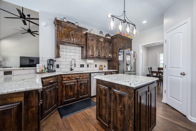 22330 Mclouth Rd, Mclouth, KS 66054 - kitchen featuring dark brown cabinets, dark wood-style flooring, stainless steel appliances, and a sink