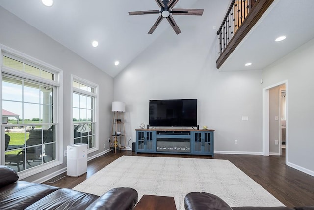 22330 Mclouth Rd, Mclouth, KS 66054 - living area featuring high vaulted ceiling, dark wood-style flooring, recessed lighting, and baseboards