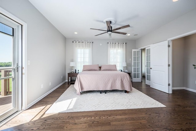 22330 Mclouth Rd, Mclouth, KS 66054 - bedroom with dark wood-style floors, baseboards, and access to exterior