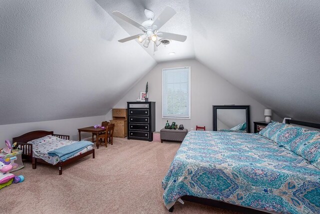 22330 Mclouth Rd, Mclouth, KS 66054 - carpeted bedroom with a textured ceiling, visible vents, vaulted ceiling, and a ceiling fan