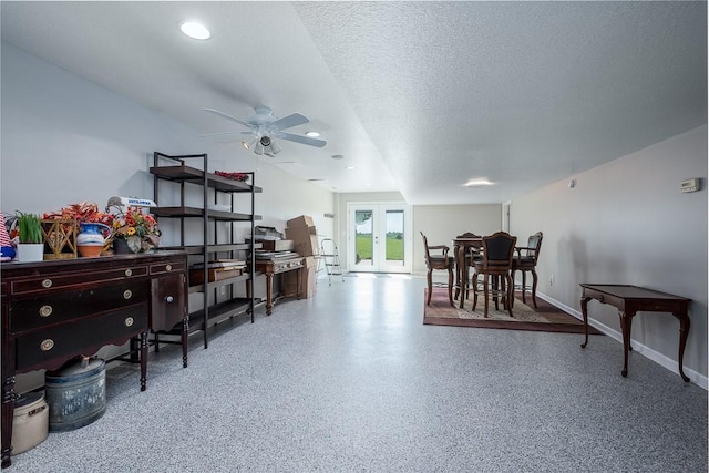 22330 Mclouth Rd, Mclouth, KS 66054 - interior space with french doors, ceiling fan, a textured ceiling, baseboards, and speckled floor