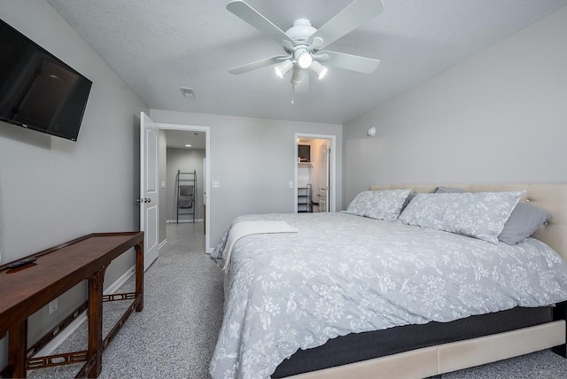 22330 Mclouth Rd, Mclouth, KS 66054 - bedroom featuring a walk in closet, visible vents, a ceiling fan, a textured ceiling, and baseboards