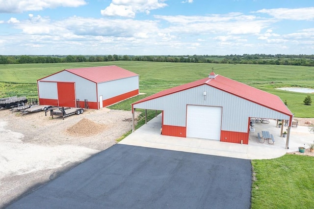 22330 Mclouth Rd, Mclouth, KS 66054 - detached garage with driveway and a rural view