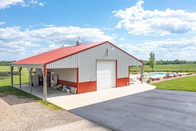 22330 Mclouth Rd, Mclouth, KS 66054 - garage featuring a garage, fence, and driveway