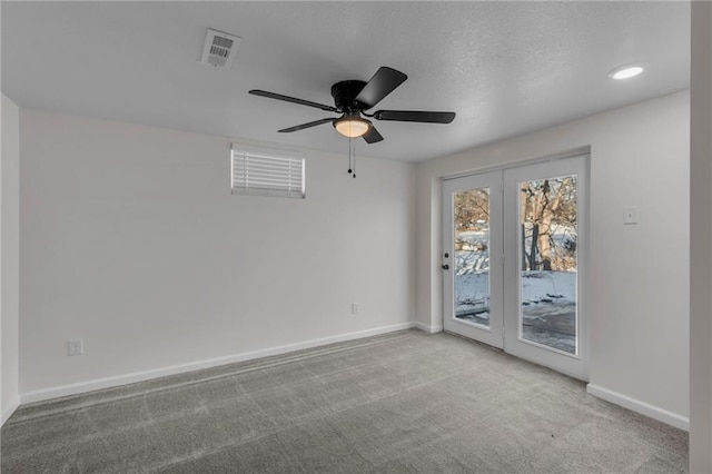 empty room featuring light carpet and ceiling fan