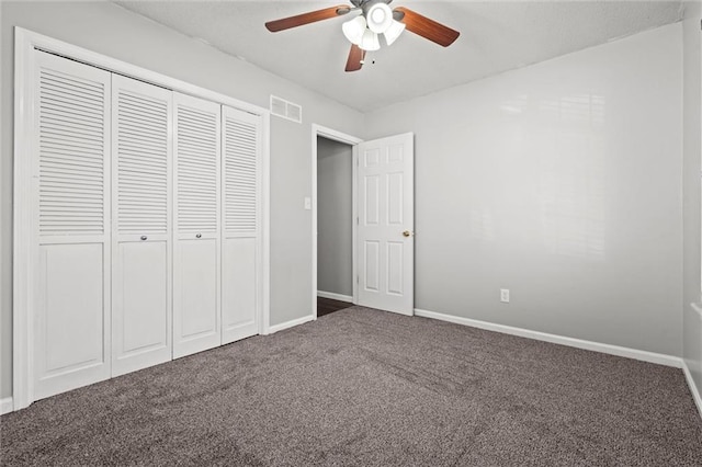 unfurnished bedroom with visible vents, baseboards, carpet, and a closet