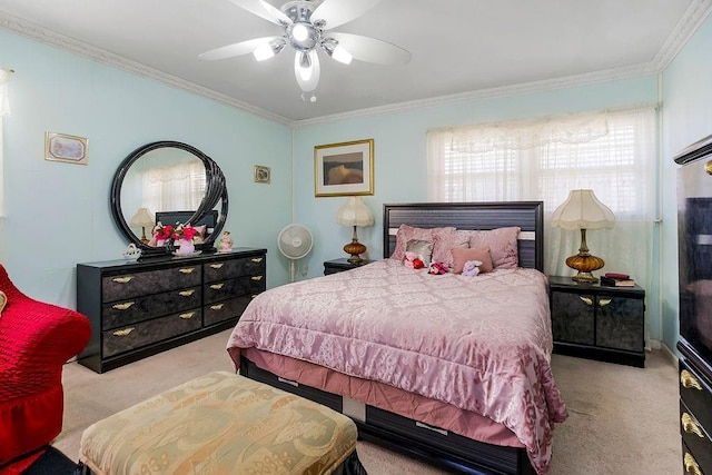 bedroom featuring ceiling fan, carpet, and ornamental molding