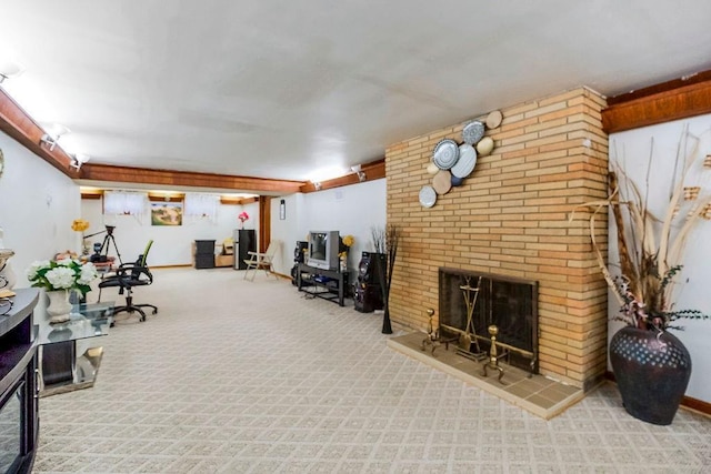 interior space with a brick fireplace, carpet flooring, and baseboards