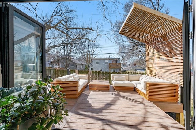 wooden deck featuring an outdoor hangout area