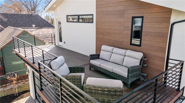 wooden deck with an outdoor living space