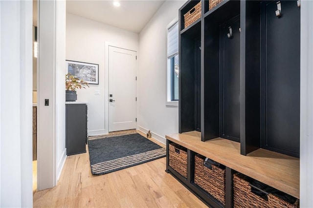 mudroom featuring light wood-type flooring and baseboards