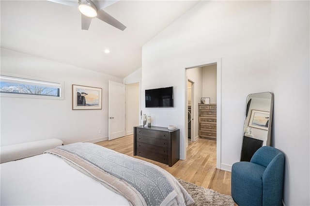 bedroom with vaulted ceiling, light wood-style flooring, a ceiling fan, and baseboards