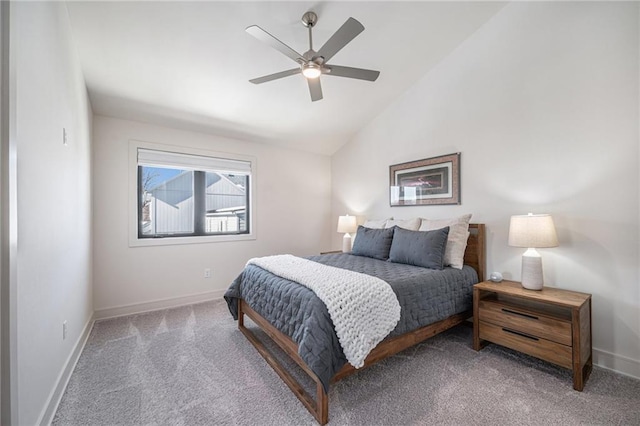 carpeted bedroom with baseboards, lofted ceiling, and a ceiling fan