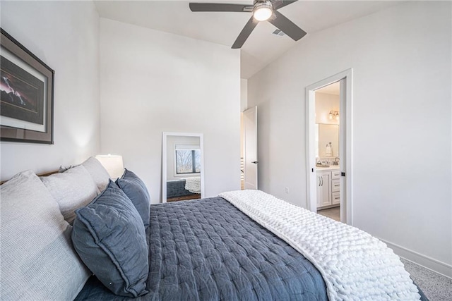 bedroom with visible vents, ceiling fan, ensuite bath, and baseboards