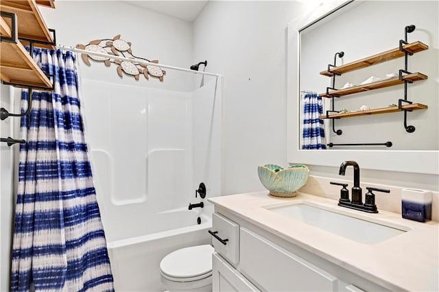 bathroom with vanity, toilet, and shower / bath combo with shower curtain