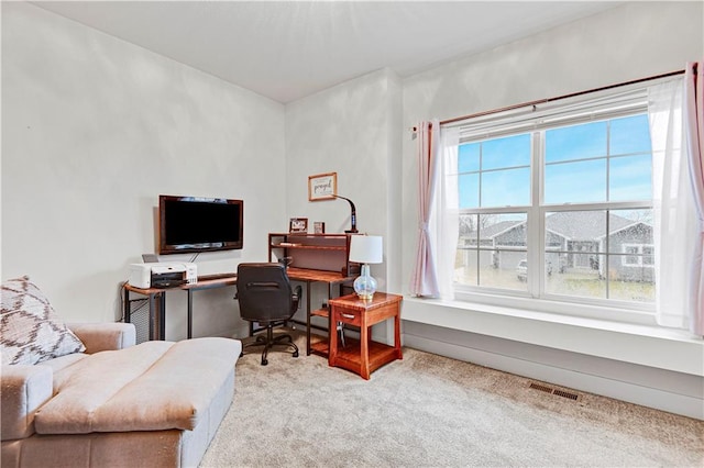 carpeted office space with visible vents