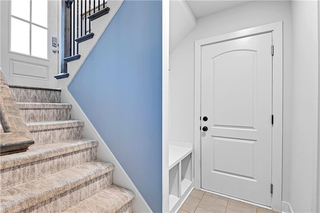 stairs with tile patterned flooring