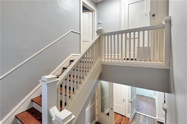 staircase featuring hardwood / wood-style floors