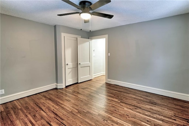 spare room featuring hardwood / wood-style floors, a textured ceiling, and ceiling fan