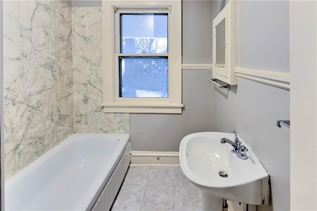 bathroom with a tub and sink