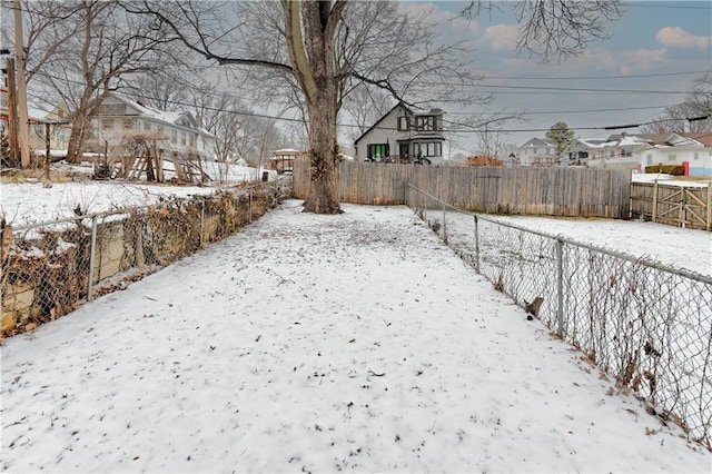 view of yard layered in snow