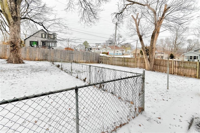 view of yard layered in snow