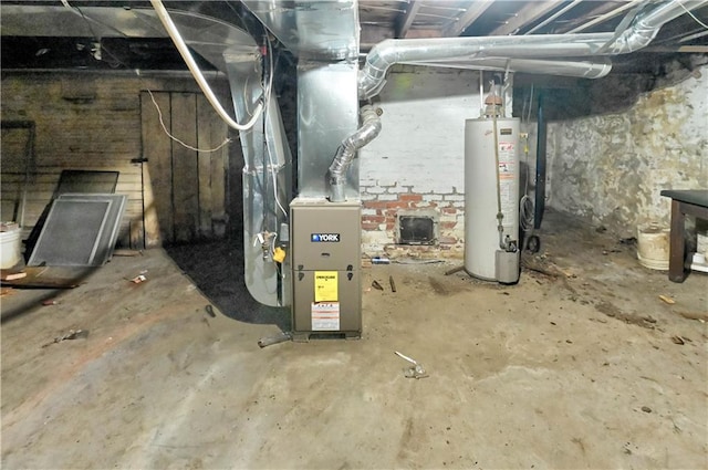 utility room featuring heating unit and gas water heater