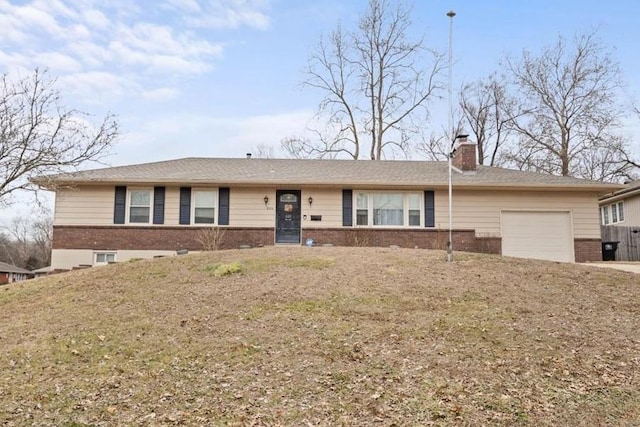 single story home featuring a garage, brick siding, a chimney, and a front yard