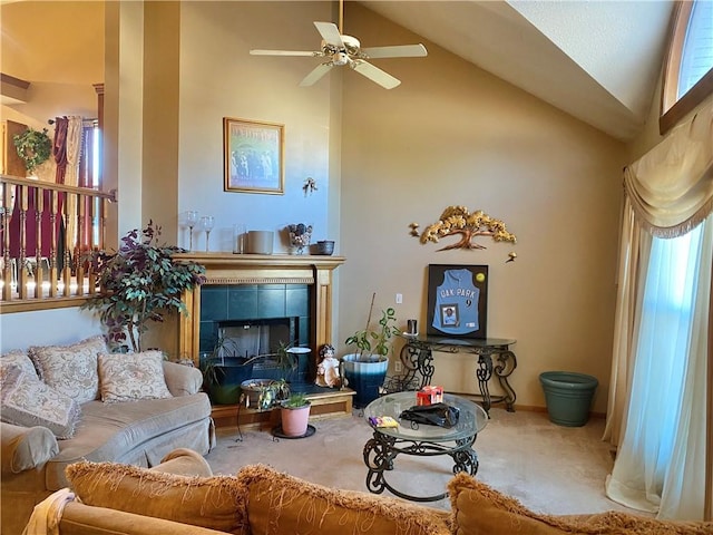 living area featuring high vaulted ceiling, carpet flooring, and a fireplace