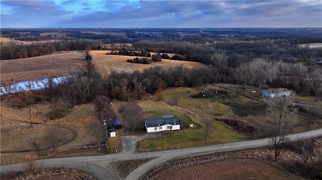 drone / aerial view featuring a water view and a rural view