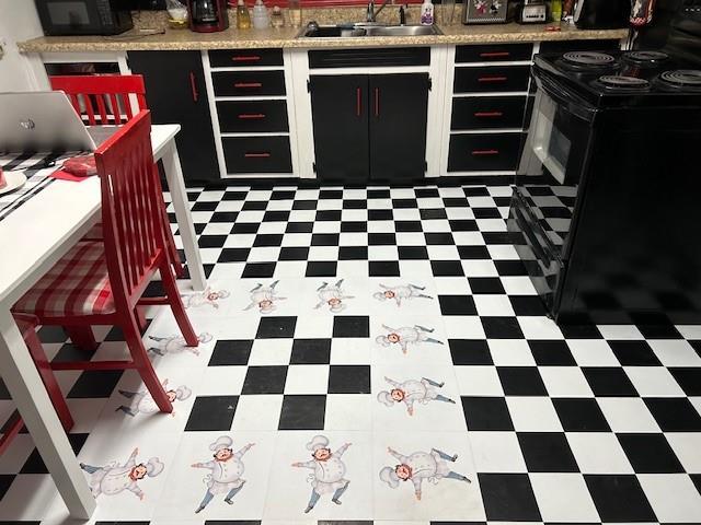 kitchen featuring sink and black appliances