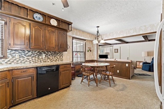 kitchen with dishwasher, light colored carpet, beamed ceiling, hanging light fixtures, and a textured ceiling