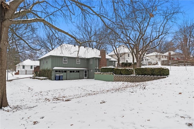 exterior space with a residential view, fence, and a chimney