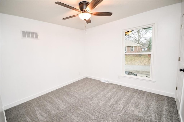 spare room featuring ceiling fan and carpet flooring