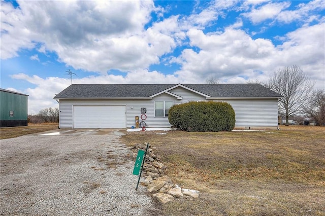 ranch-style home with gravel driveway, roof with shingles, and an attached garage