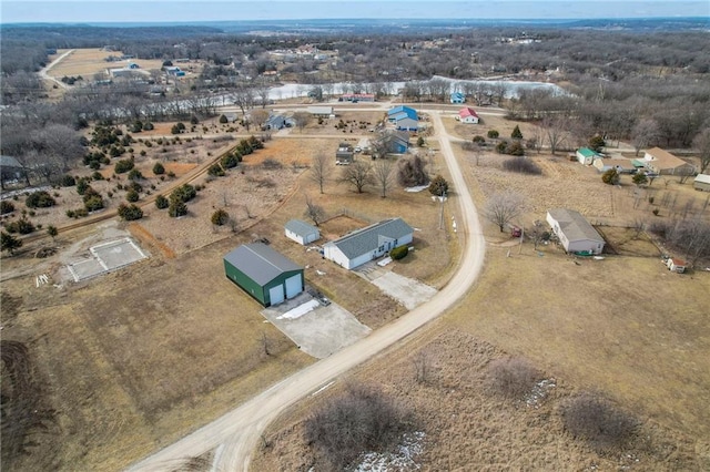 birds eye view of property with a rural view