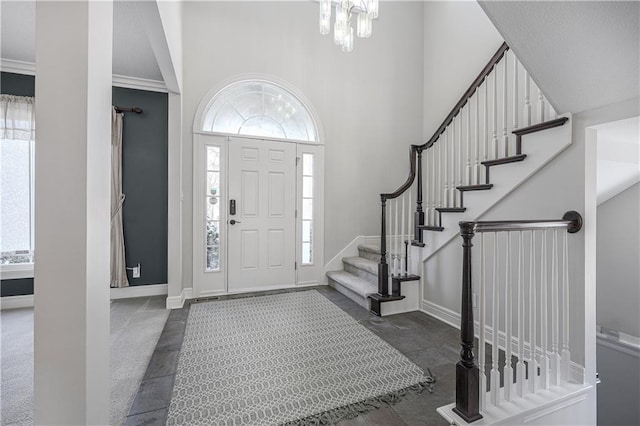 entryway with a towering ceiling