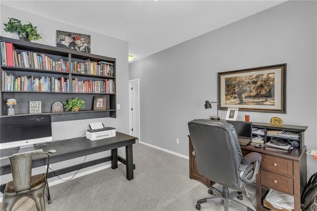 carpeted office with baseboards