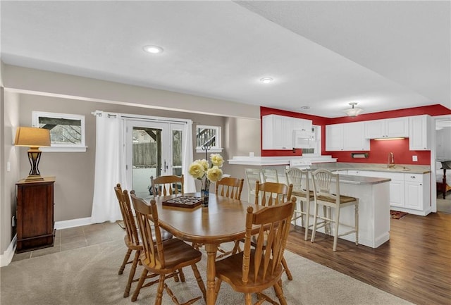 dining room featuring recessed lighting, baseboards, and wood finished floors