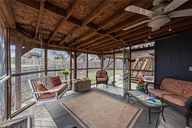 sunroom featuring a wealth of natural light and ceiling fan