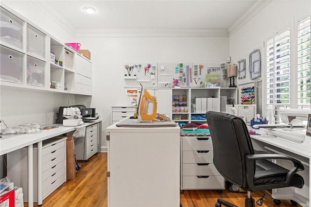 office area featuring crown molding and light wood-type flooring