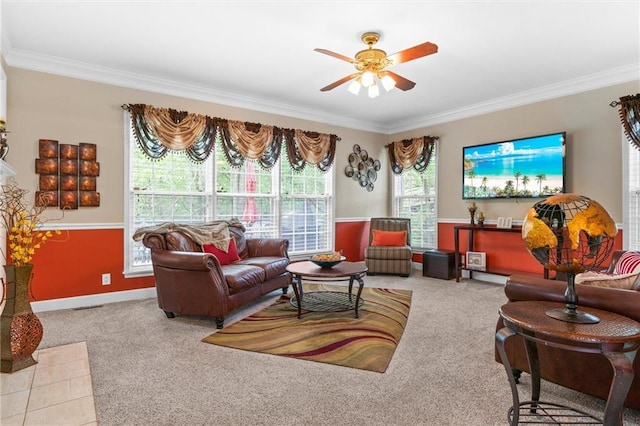 carpeted living room featuring ornamental molding and ceiling fan